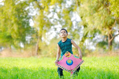 Indian child playing with kite