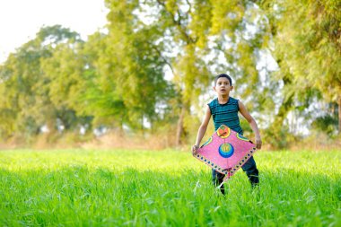 Indian child playing with kite