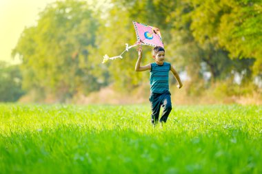 Indian child playing with kite