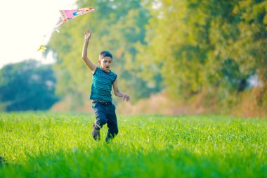Indian child playing with kite