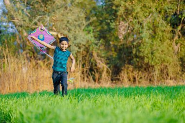 Indian child playing with kite