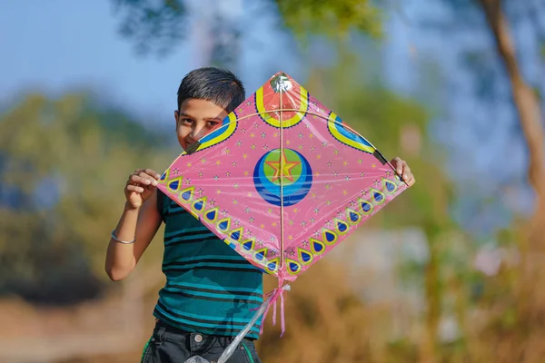 Indian child playing with kite