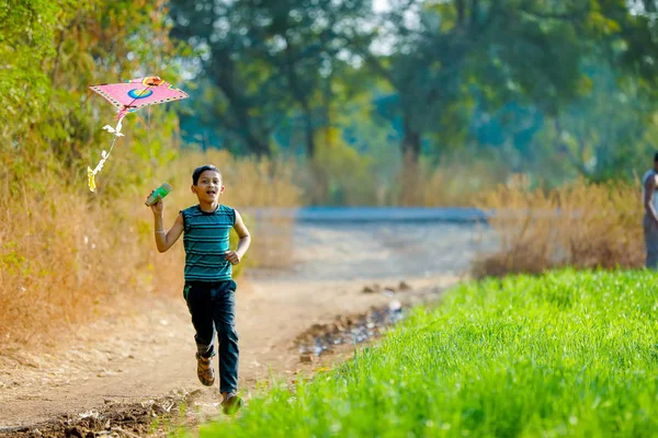 Indian Child Playing Kite Fotos De Stock