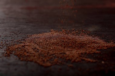 mustard seed on black background