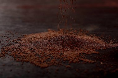 mustard seed on black background