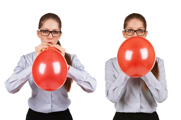 Girl inflates a red ball — Stock Photo, Image