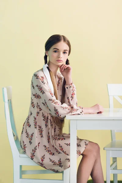 Beautiful Stylish Teen Girl Braids Sitting Table Isolated Yellow — Free Stock Photo