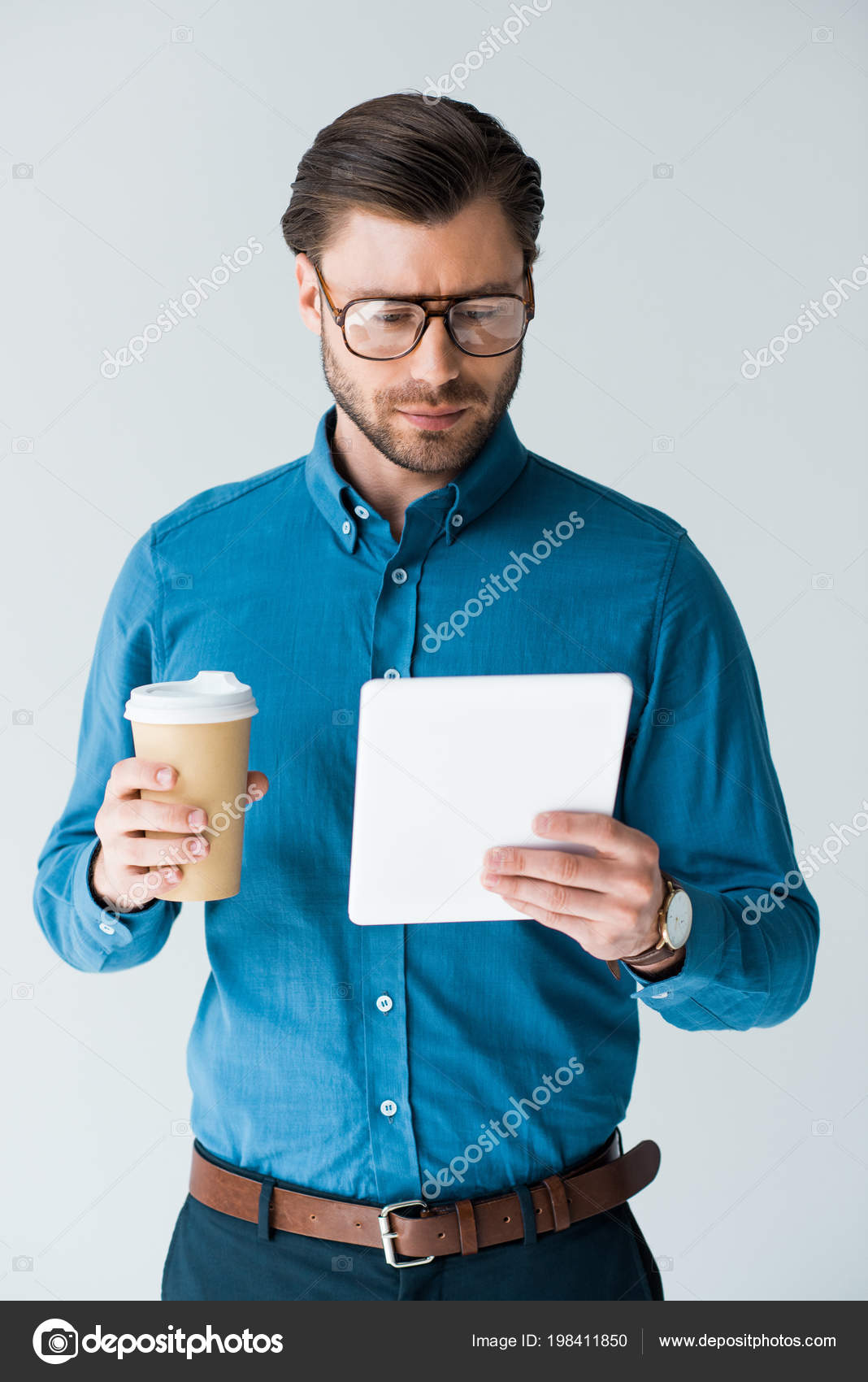 Focused Young Man Paper Cup Coffee Using Tablet Isolated White Stock Photo Image By C Andrewlozovyi