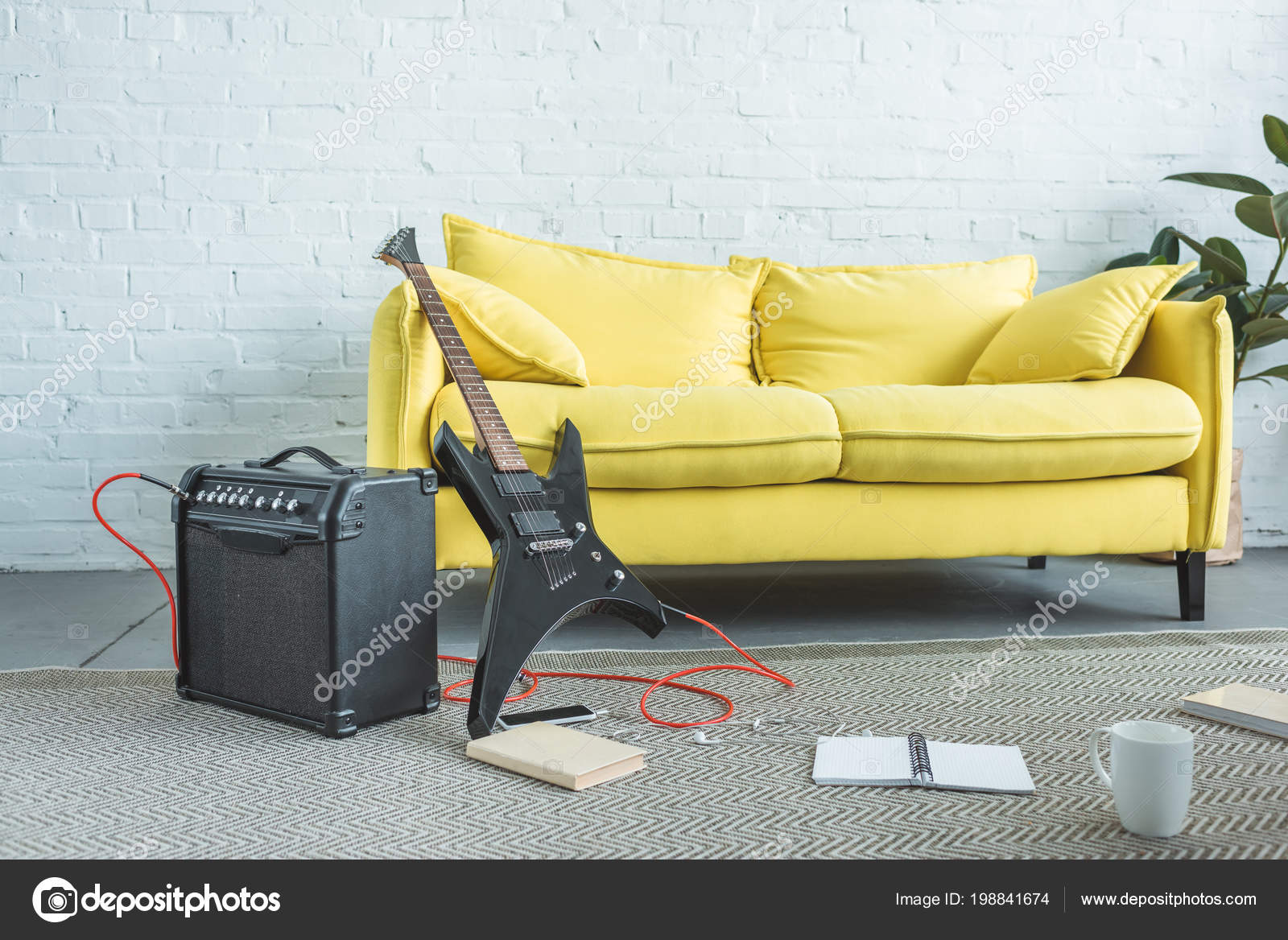 Electric Guitar Loud Speaker Smartphone Books Cup Coffee Floor Yellow
