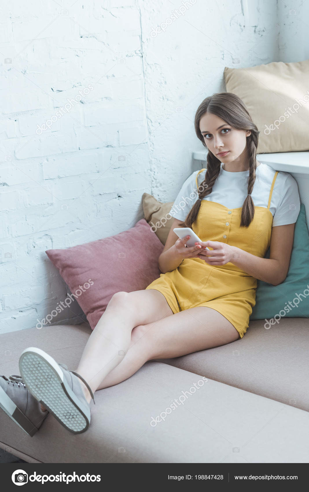 Pretty teen in sofa