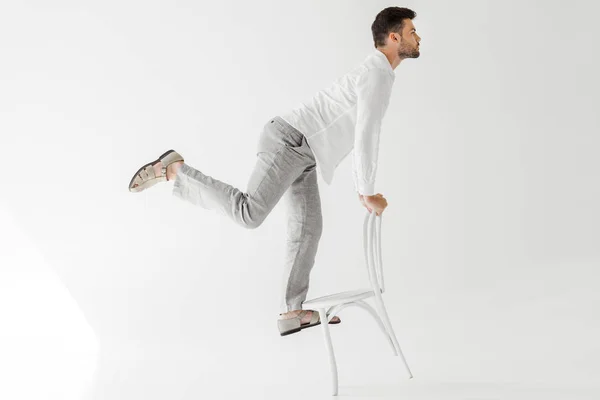 Profile Male Model Linen Clothes Balancing Chair Isolated Grey Background — Stock Photo, Image