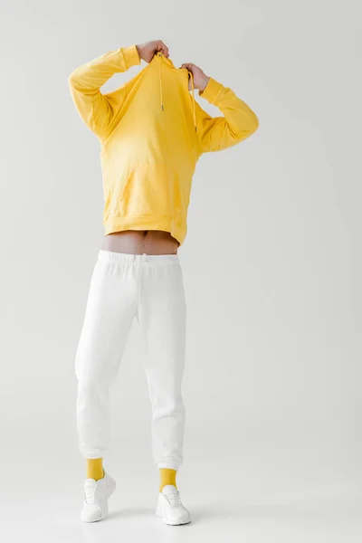 Young Man Taking Yellow Hoodie White — Stock Photo, Image