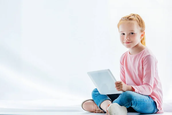 Beautiful Redhead Child Using Digital Tablet Smiling Camera While Sitting — Stock Photo, Image