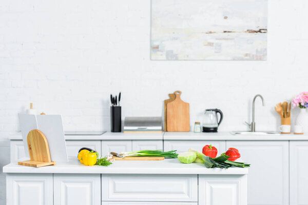 vegetables on kitchen counter in light modern kitchen