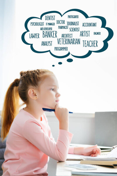 side view of thoughtful schoolgirl holding pen and looking away while studying with words of different professions in speech bubble