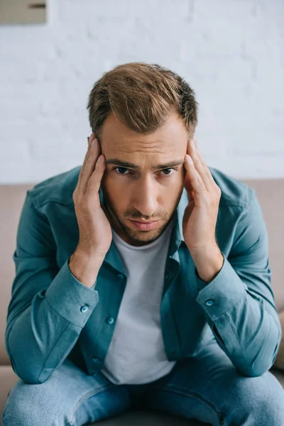 Young Man Headache Looking Camera Home — Free Stock Photo