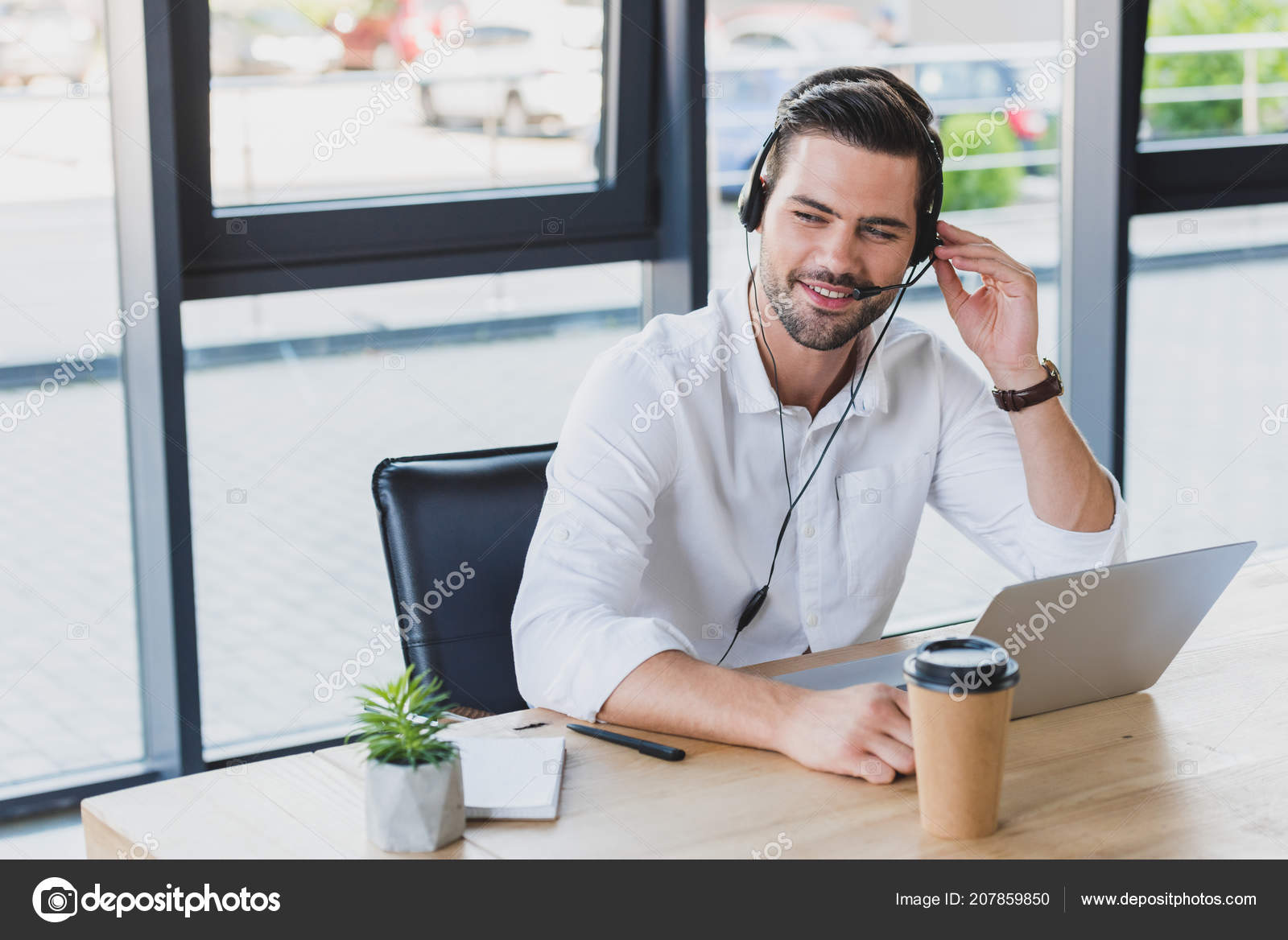 Handsome Smiling Young Call Center Operator Headset Using Laptop Office