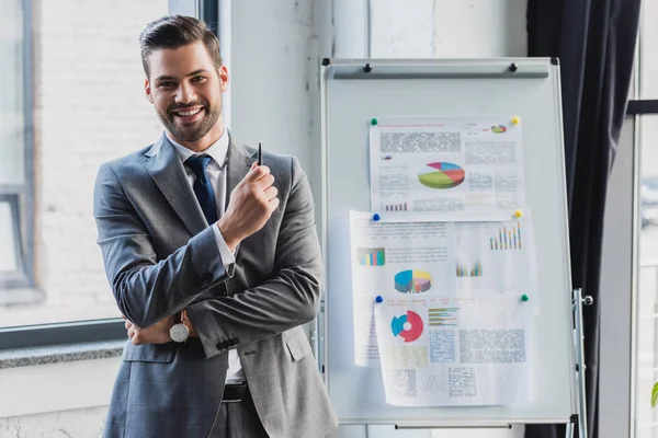 Handsome Young Businessman Smiling Camera While Standing Whiteboard Business Charts — Stock Photo, Image