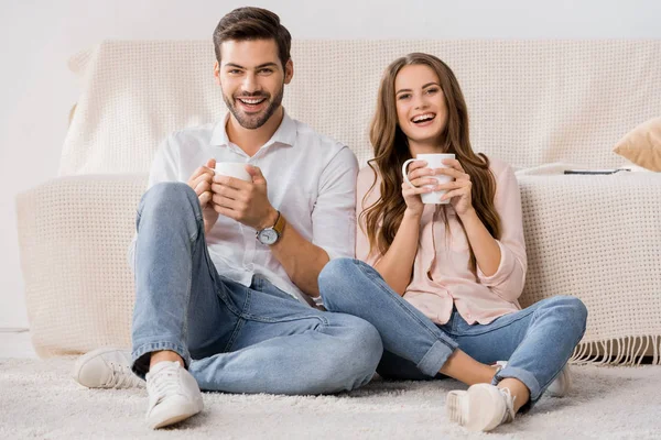 Happy Loving Couple Cups Coffee Resting Sofa Home — Stock Photo, Image