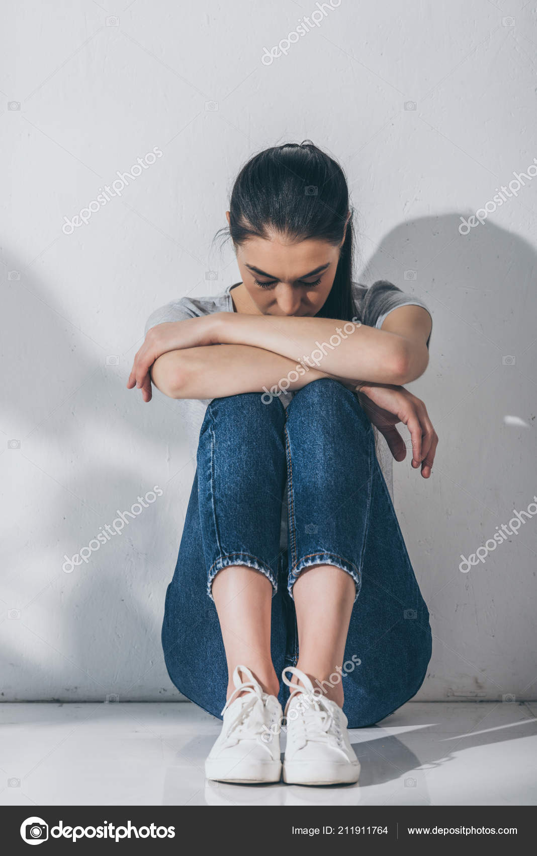 Girl Sitting With Her Knees To Chest Outdoors Stock Photo - Download Image  Now - Fetal Position, Sitting, One Woman Only - iStock