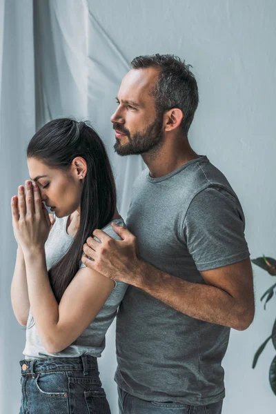 Side View Bearded Man Embracing Supporting Sad Young Woman Hands — Stock Photo, Image