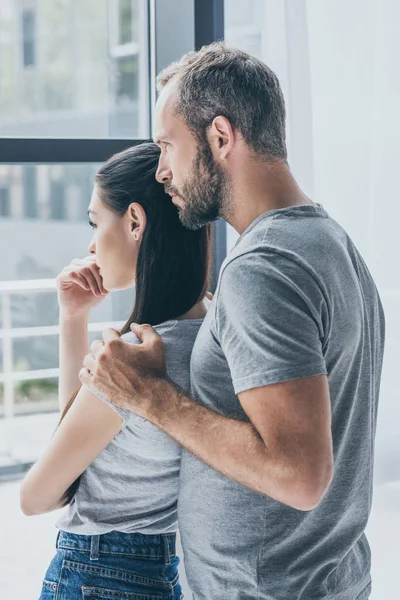 Side View Sad Couple Standing Together Looking Window — Stock Photo, Image