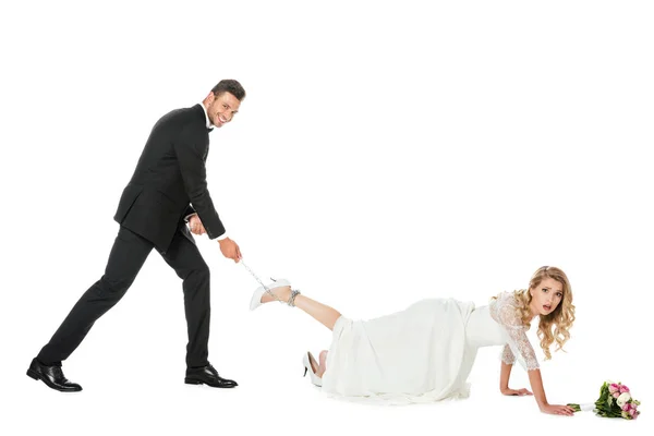 Happy Groom Holding Chain Tied Brides Leg Looking Camera Isolated — Stock Photo, Image