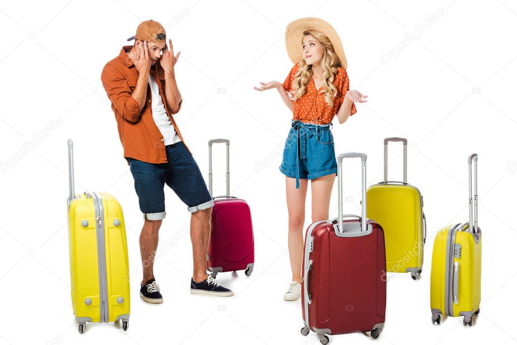 shocked boyfriend looking at girlfriend luggage isolated on white