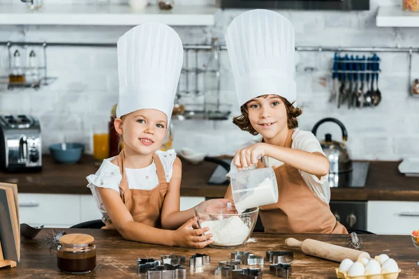 Cute Little Children Chef Hats Preparing Dough Cookies Smiling Camera — Stock Photo, Image