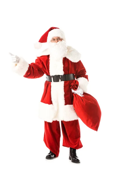 Santa Claus Holding Sack Pointing Away While Looking Camera Isolated — Stock Photo, Image