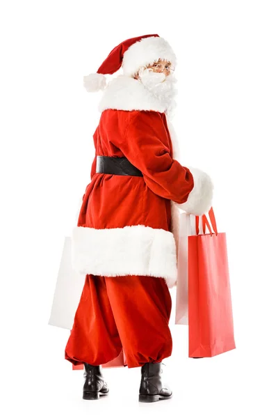 Święty Mikołaj Torby Papierowe Patrząc Kamery Białym Tle — Darmowe zdjęcie stockowe