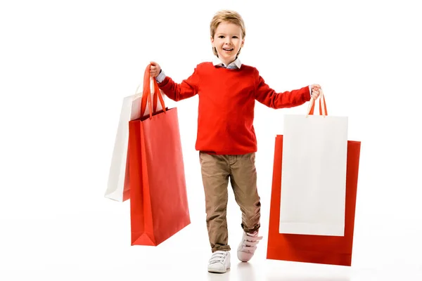 Niño Feliz Sosteniendo Grandes Bolsas Compras Aisladas Blanco — Foto de Stock