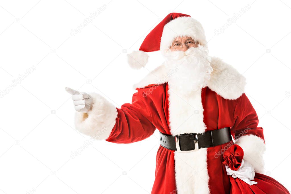 santa claus pointing away while looking at camera isolated on white