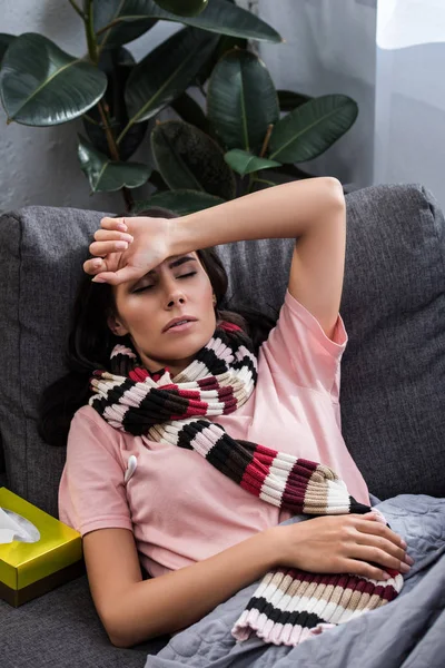 Sick Young Woman Scarf Lying Couch Home — Free Stock Photo