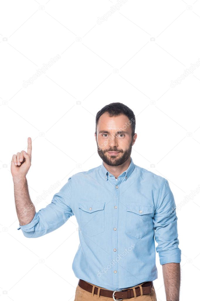 man in blue shirt pointing up isolated on white 