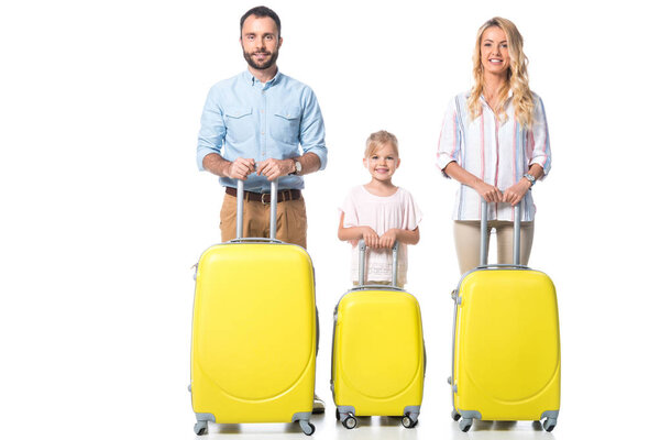 family with yellow suitcases looking at camera isolated on white