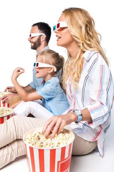 side view of family with popcorn and 3d glasses isolated on white