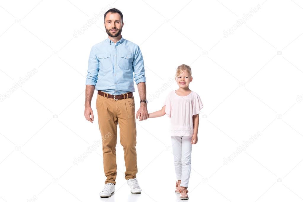 father and daughter holding hands and looking at camera isolated on white