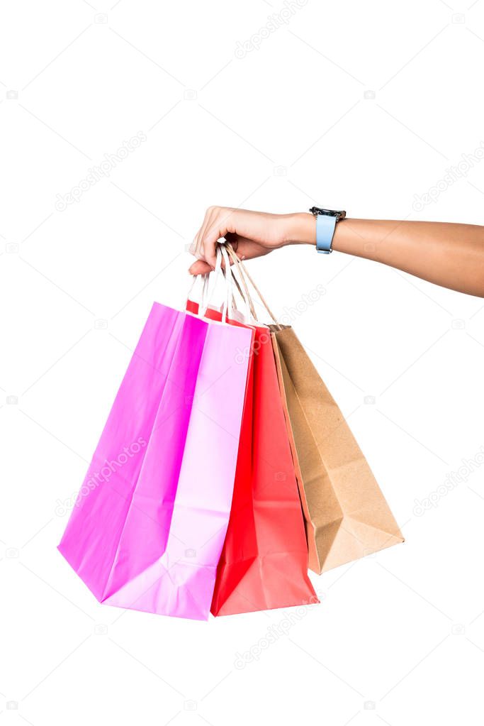 woman holding shopping bags isolated on white