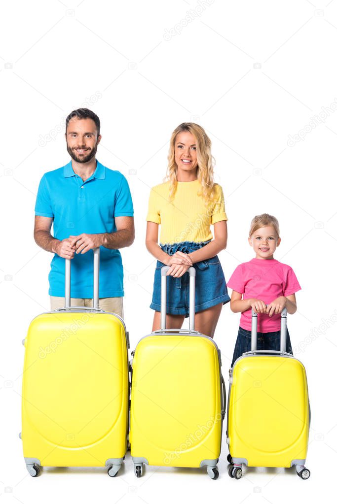 smiling family with travel bags isolated on white