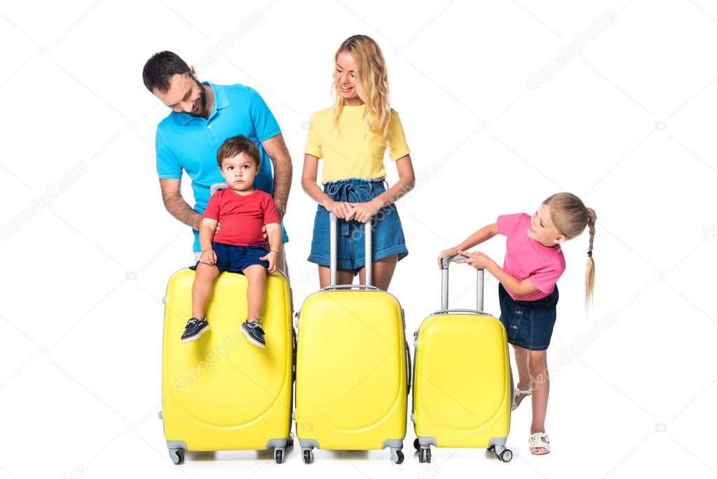 family with yellow baggage isolated on white