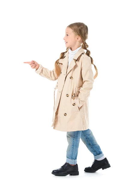 Adorable Kid Beige Coat Pointing Somewhere Isolated White — Free Stock Photo