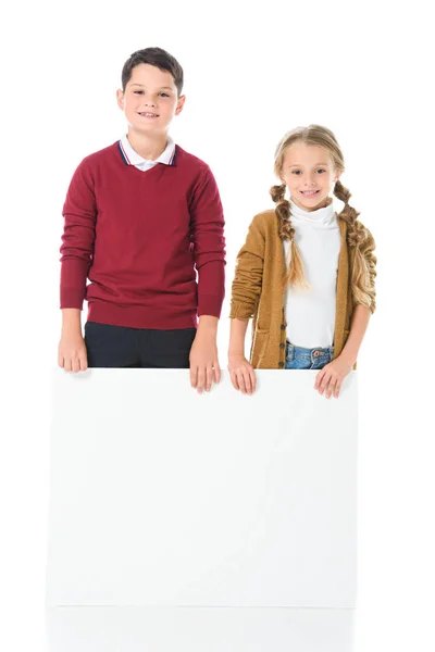 Smiling Siblings Standing Empty Board Isolated White — Free Stock Photo
