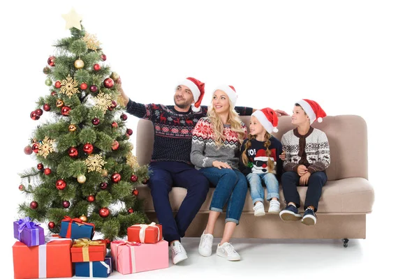 Happy Family Santa Hats Sitting Sofa Christmas Tree Presents Isolated — Stock Photo, Image