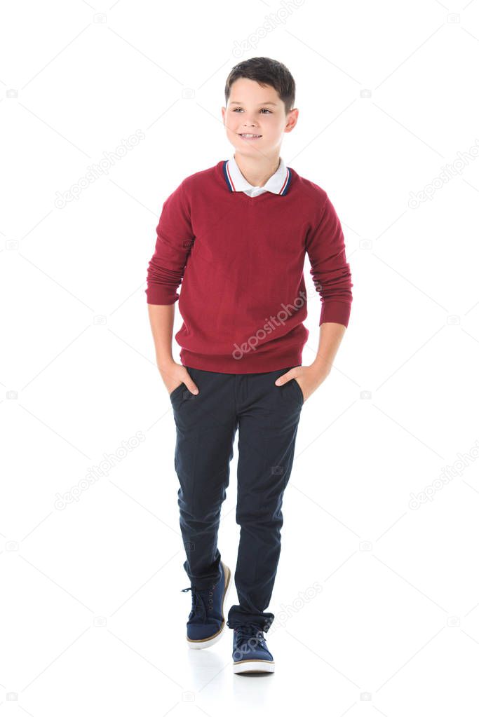 smiling boy posing in red sweater isolated on white