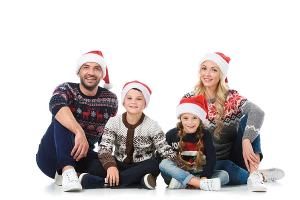 Happy Parents Children Sitting Christmas Sweaters Santa Hats Isolated White — Stock Photo, Image