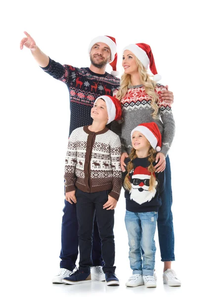 Happy Family Kids Christmas Sweaters Santa Hats Father Showing Something — Stock Photo, Image