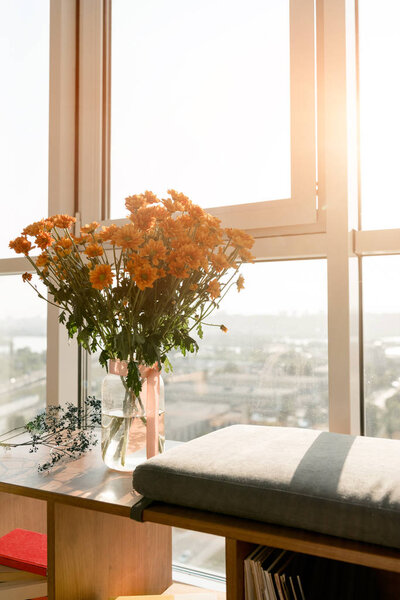 close up view of beautiful bouquet of flowers standing at window