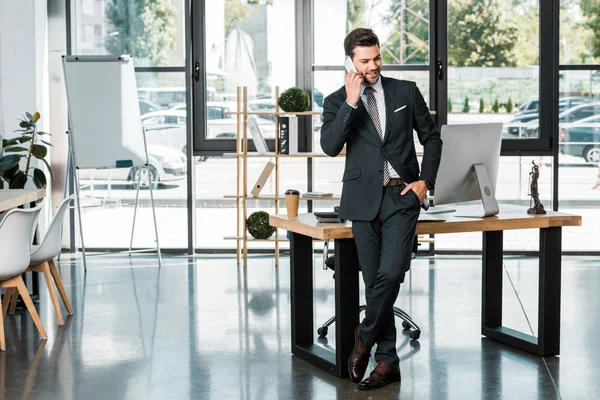 Handsome Cheerful Businessman Leaning Table Talking Smartphone Office — Stock Photo, Image