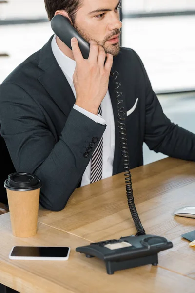 Handsome Businessman Talking Stationary Telephone Office — Free Stock Photo
